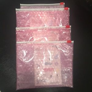 Glossier pink pouch with sticker sheet